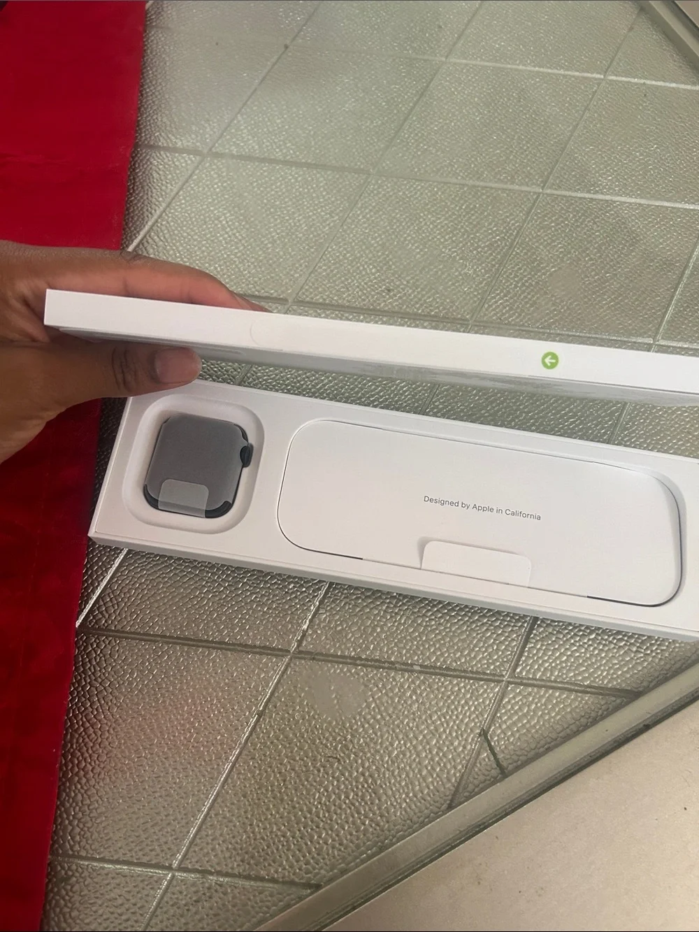 Apple Watch with Black Sport Band in White Packaging